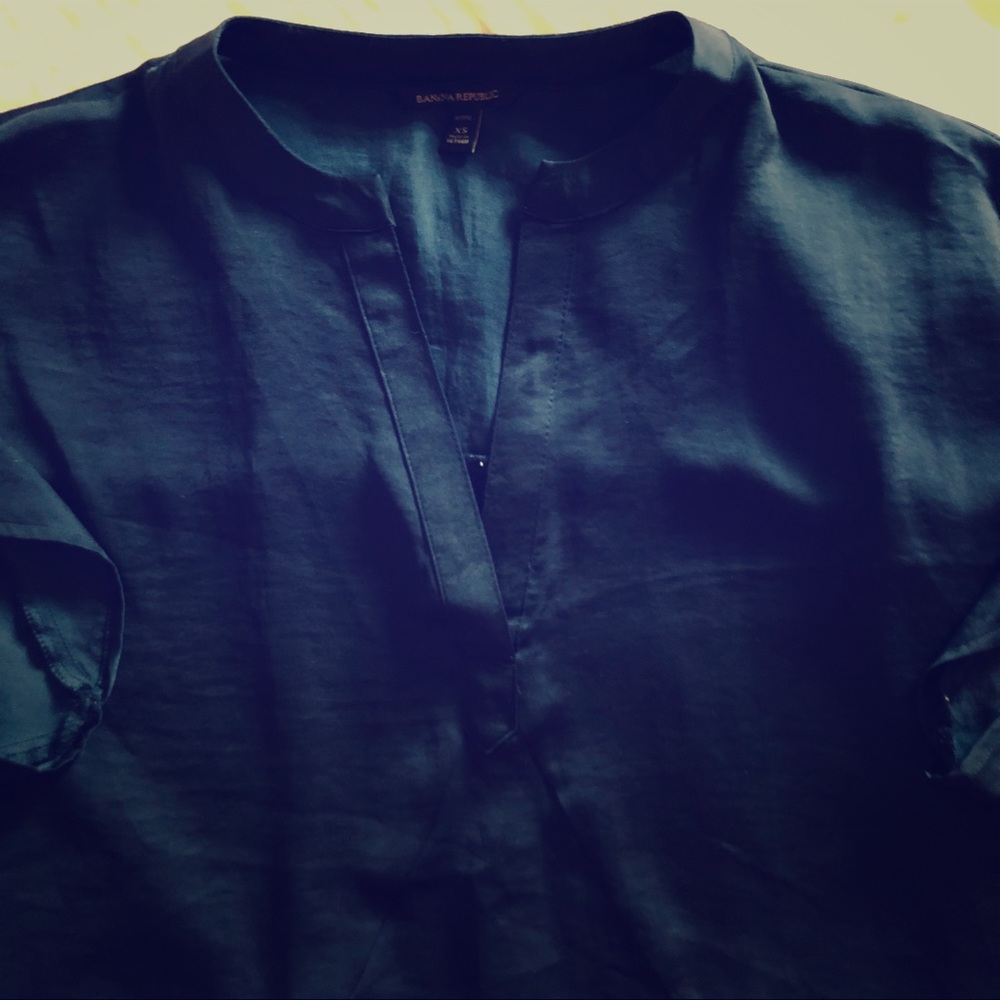 Navy blue tunic with cap sleeves.